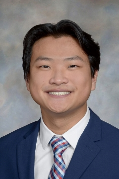 Timothy O. smiling outdoors